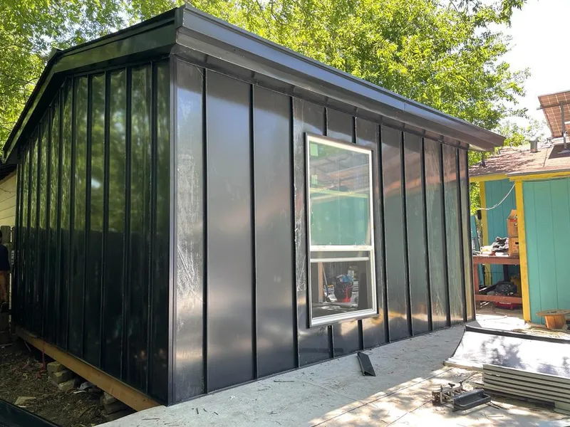 Black standing seam metal wall panels for Roof Inspection in West Carson