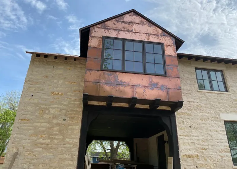 Copper metal panel facade on a stone building for Metal Roof Coating in West Carson