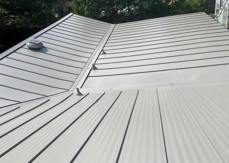 Solar attic fan installed on a metal roof for Roof Ventilation in West Carson